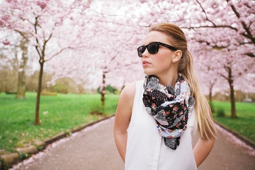 Fashionable woman wearing scarf outdoors